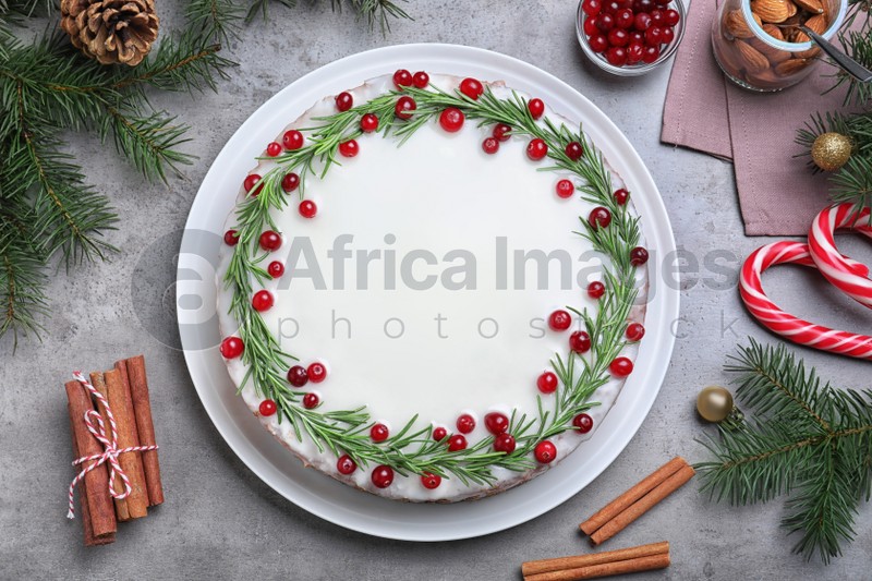 Photo of Flat lay composition with traditional Christmas cake on light grey table