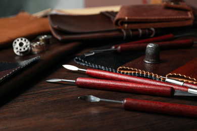 Leather samples and tools on wooden table