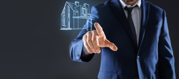 Real estate agent touching house illustration on virtual screen against dark background, closeup. Banner design 