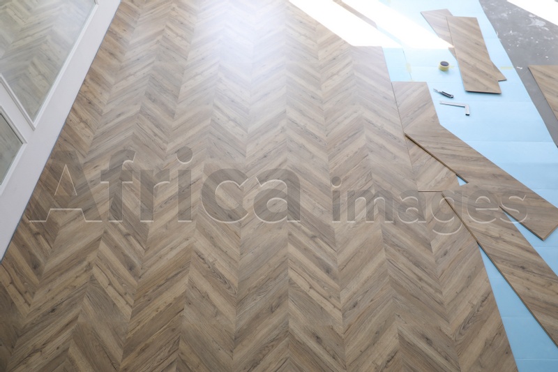 Installation of laminated wooden floor at home