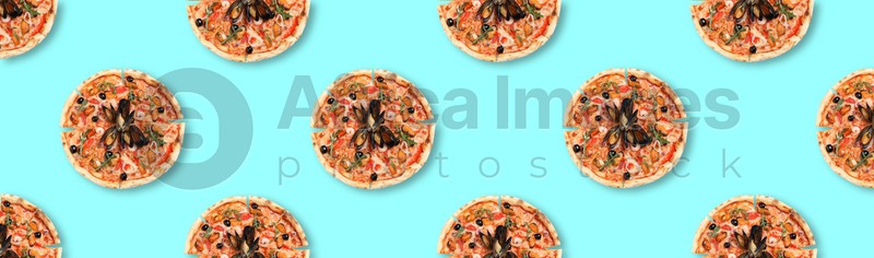 Many delicious seafood pizzas on turquoise background, flat lay. Seamless pattern design