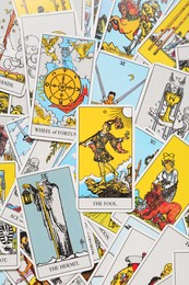 Many tarot cards as background, top view