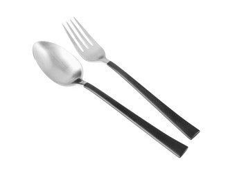 New fork and spoon with black handles on white background