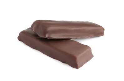 Tasty chocolate glazed protein bars on white background. Healthy snack