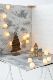Christmas decor and double-sided backdrops on table in photo studio