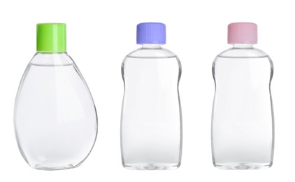 Set with bottles of baby oils on white background
