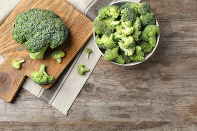 Flat lay composition with fresh green broccoli on wooden background