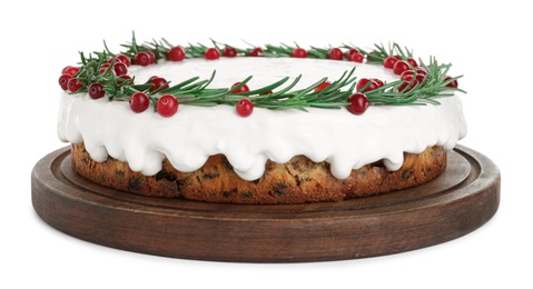 Traditional Christmas cake decorated with rosemary and cranberries isolated on white