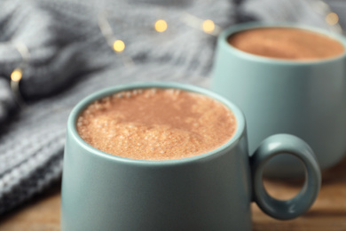 Cup of delicious hot cocoa, closeup view