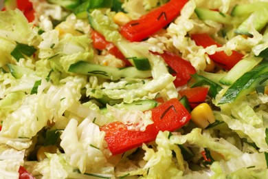 Delicious salad with Chinese cabbage, cucumber and bell pepper as background, closeup