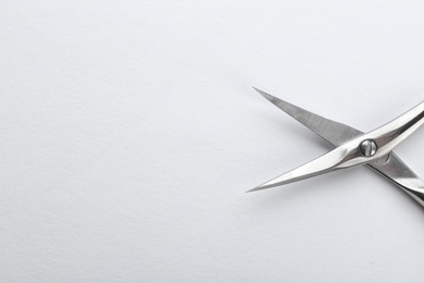Pair of nail scissors on white background, closeup