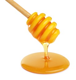 Honey dripping from dipper on white background