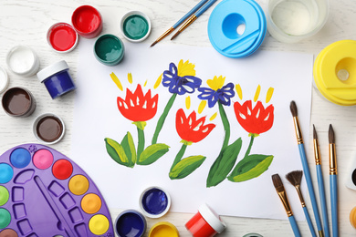 Flat lay composition with child's painting of flowers on white wooden table