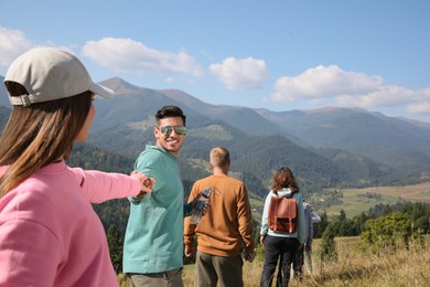 Group of people spending time together in mountains