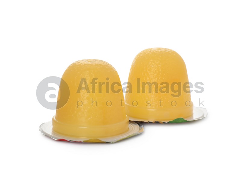 Delicious yellow jelly cups on white background