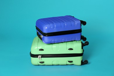 Modern suitcases for travelling on blue background