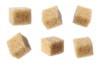 Set with cubes of brown sugar on white background