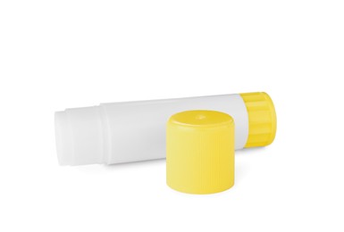 Open blank glue stick with yellow cap on white background