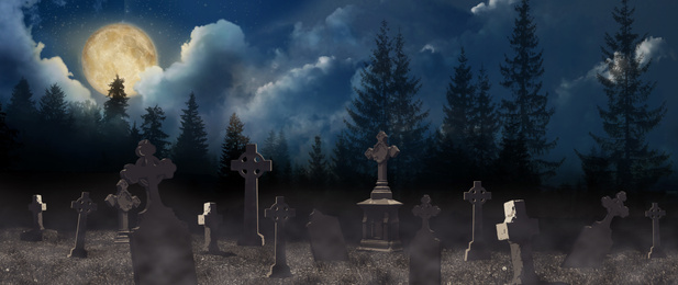 Misty cemetery with old creepy headstones under full moon. Halloween banner design