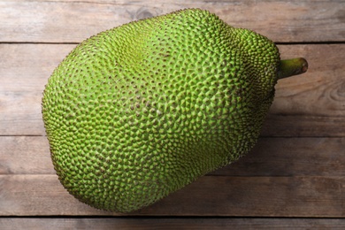 Fresh exotic jackfruit on wooden table, top view