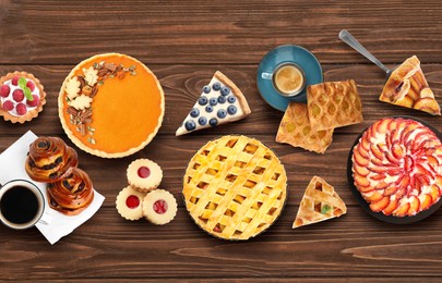 Flat lay composition with different delicious pies on wooden table 