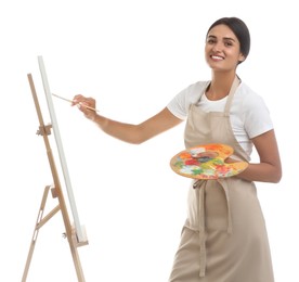 Young woman drawing on easel against white background