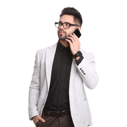 Young businessman talking on smartphone against white background