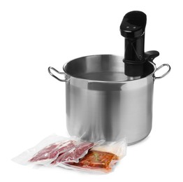 Thermal immersion circulator in pot and meat on white background. Vacuum packing for sous vide cooking