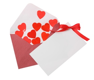 Blank card, envelope and red decorative hearts on white background, top view. Valentine's Day celebration
