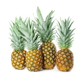 Photo of Fresh ripe juicy pineapples isolated on white