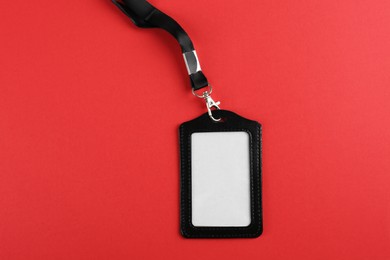 Blank badge on red background, top view. Mockup for design