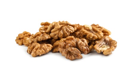 Pile of peeled walnuts on white background