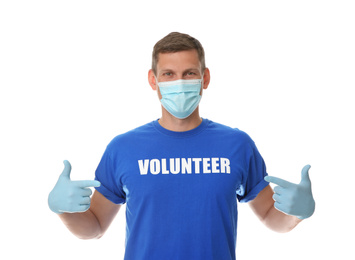 Male volunteer in mask and gloves on white background. Protective measures during coronavirus quarantine