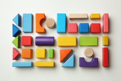 Colorful wooden construction set on white background top view