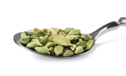 Spoon full of cardamom on white background, closeup