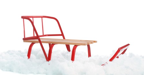 Sleigh and artificial snow on white background. Winter outdoor activity