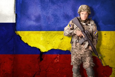 Armed Ukrainian soldier against national flag of Ukraine. Russian-Ukrainian war, 2022