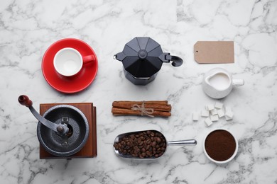 Photo of Flat lay composition with vintage manual grinder and geyser coffee maker on white marble table