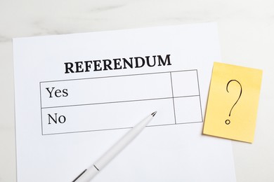 Referendum ballot, pen and sticky note with question mark on white marble table, flat lay