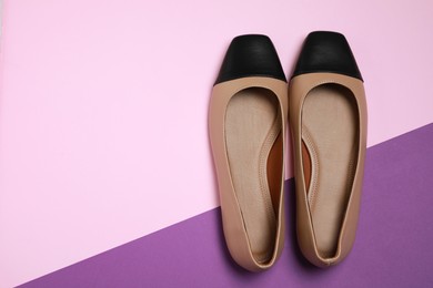 Photo of Pair of new stylish square toe ballet flats on colorful background, flat lay. Space for text