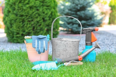 Set of gardening tools on green grass