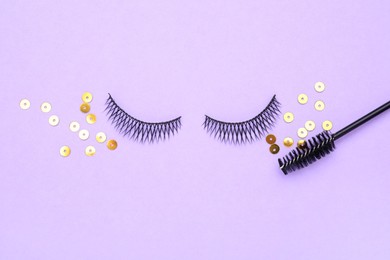 Photo of False eyelashes, sequins and mascara brush on violet background, flat lay