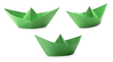 Set with green paper boats on white background