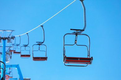 Empty chairlift at mountain ski resort. Winter vacation