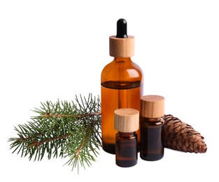 Bottles of pine essential oil on white background