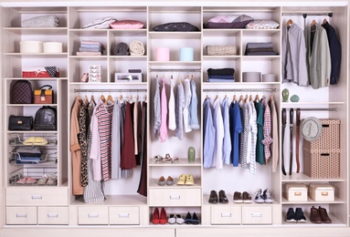 Large wardrobe with different clothes, home stuff and shoes