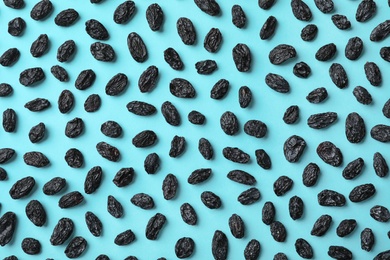 Flat lay composition with raisins on color background. Dried fruit as healthy snack