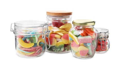 Jars with tasty jelly candies on white background