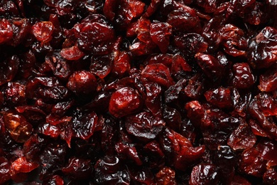 Tasty cranberries as background, top view. Dried fruits as healthy snack