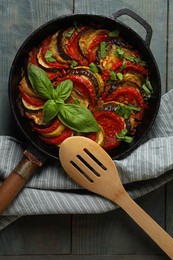 Photo of Delicious ratatouille on light blue wooden table, top view